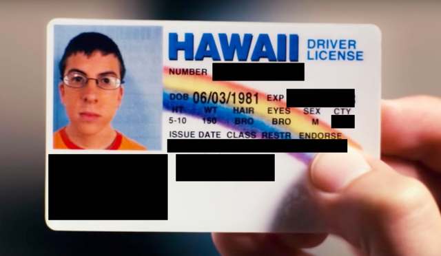 A photo of a (fake) Hawaii driver license with some fields covered with black boxes